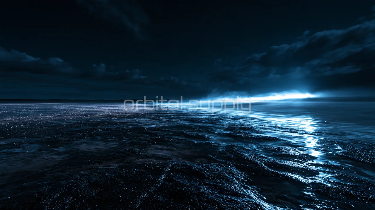 A distant ribbon of blue mist lights a dark wet coastal plain.