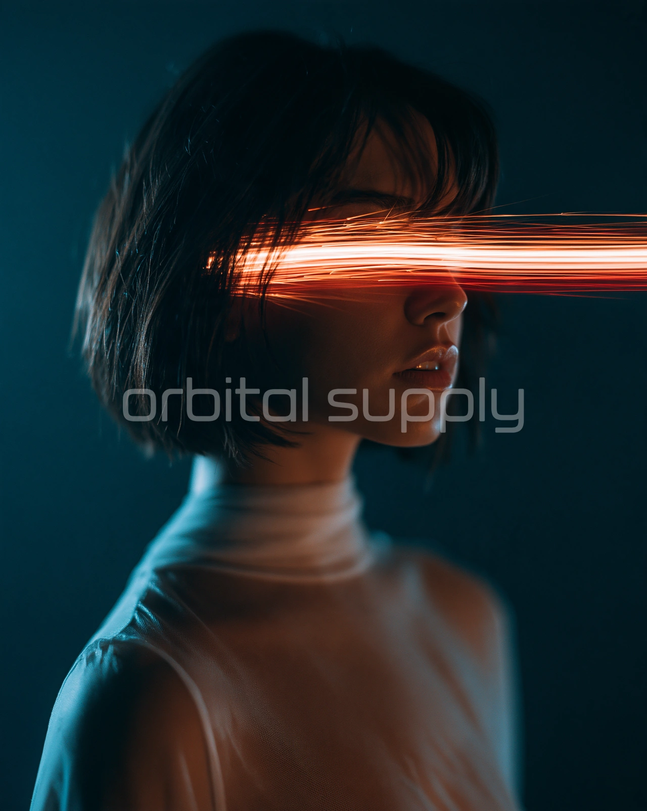 A ribbon of coral light crosses the eyes of a person with short dark hair against a teal background.