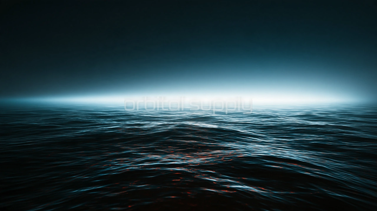 A dark sea under teal haze with a bright band of light along the horizon.